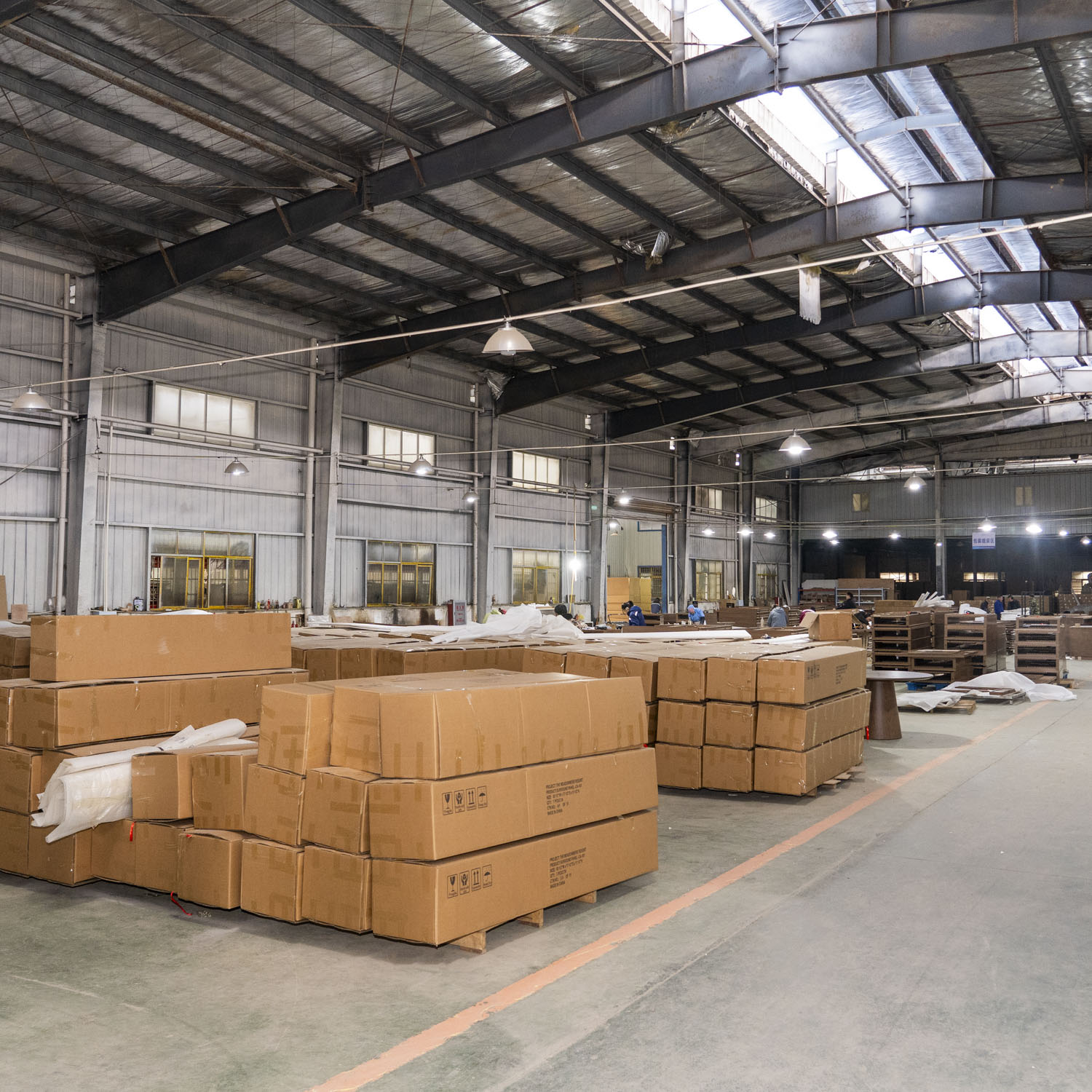 Large-scale staging area at Hyman Hospitality factory featuring professional export packaging for bulk hotel FF&E orders destined for North America.
