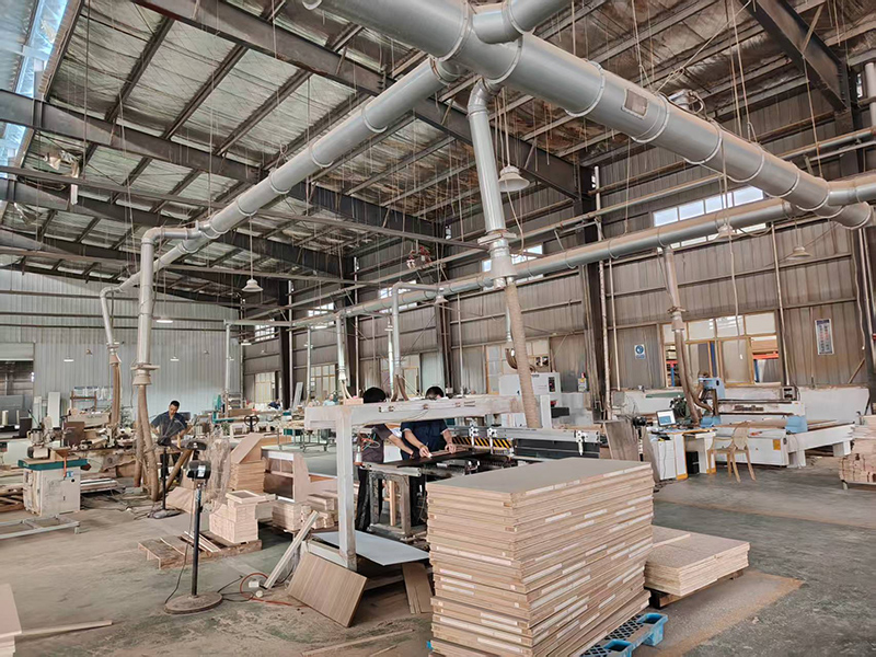 Assembly line in Hyman Hospitality facility where furniture components are joined and assembled into casegoods, demonstrating batch production.