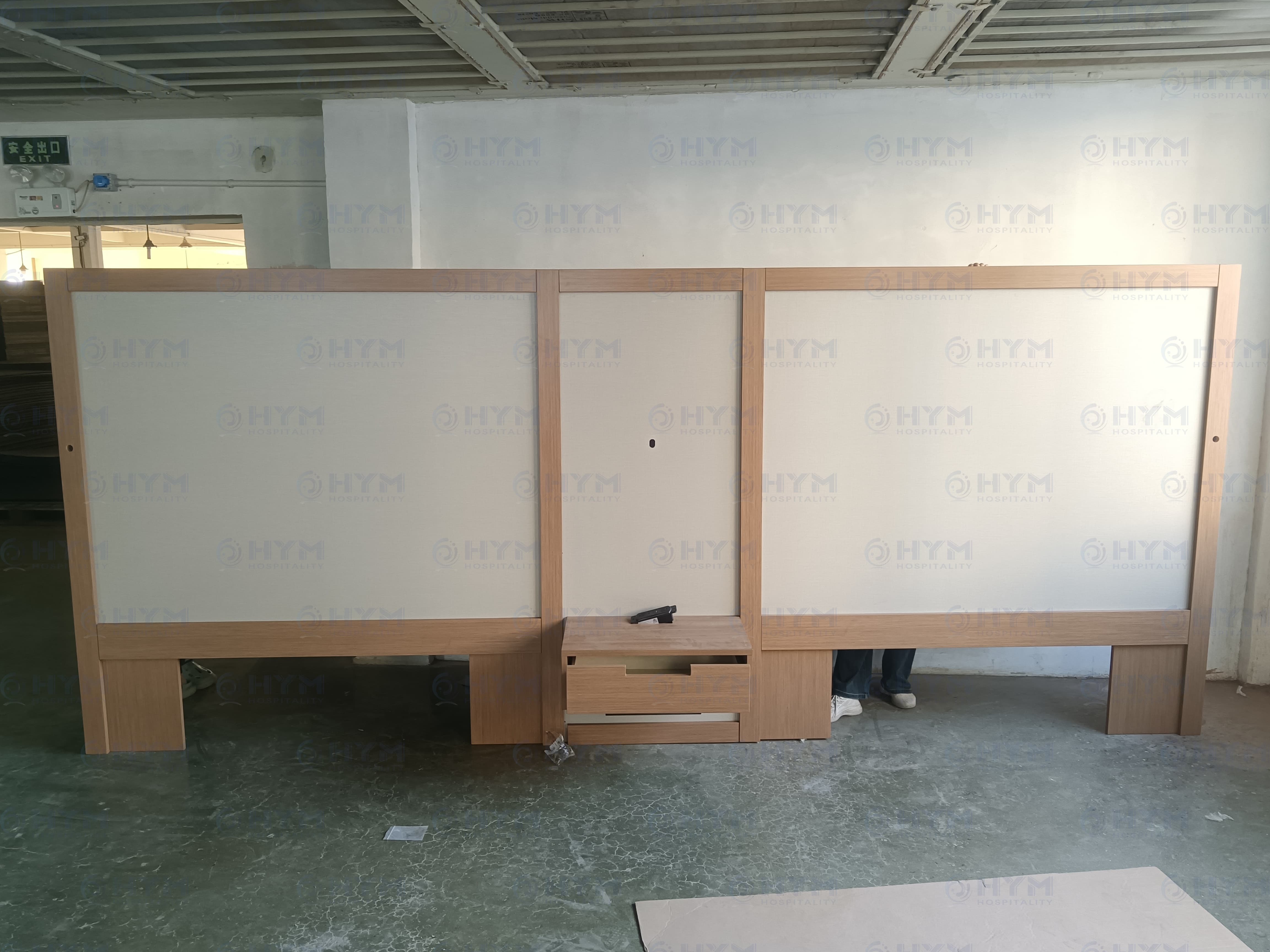 Integrated headboard and nightstand for Fairfield Inn suites with HPL finish and power outlets