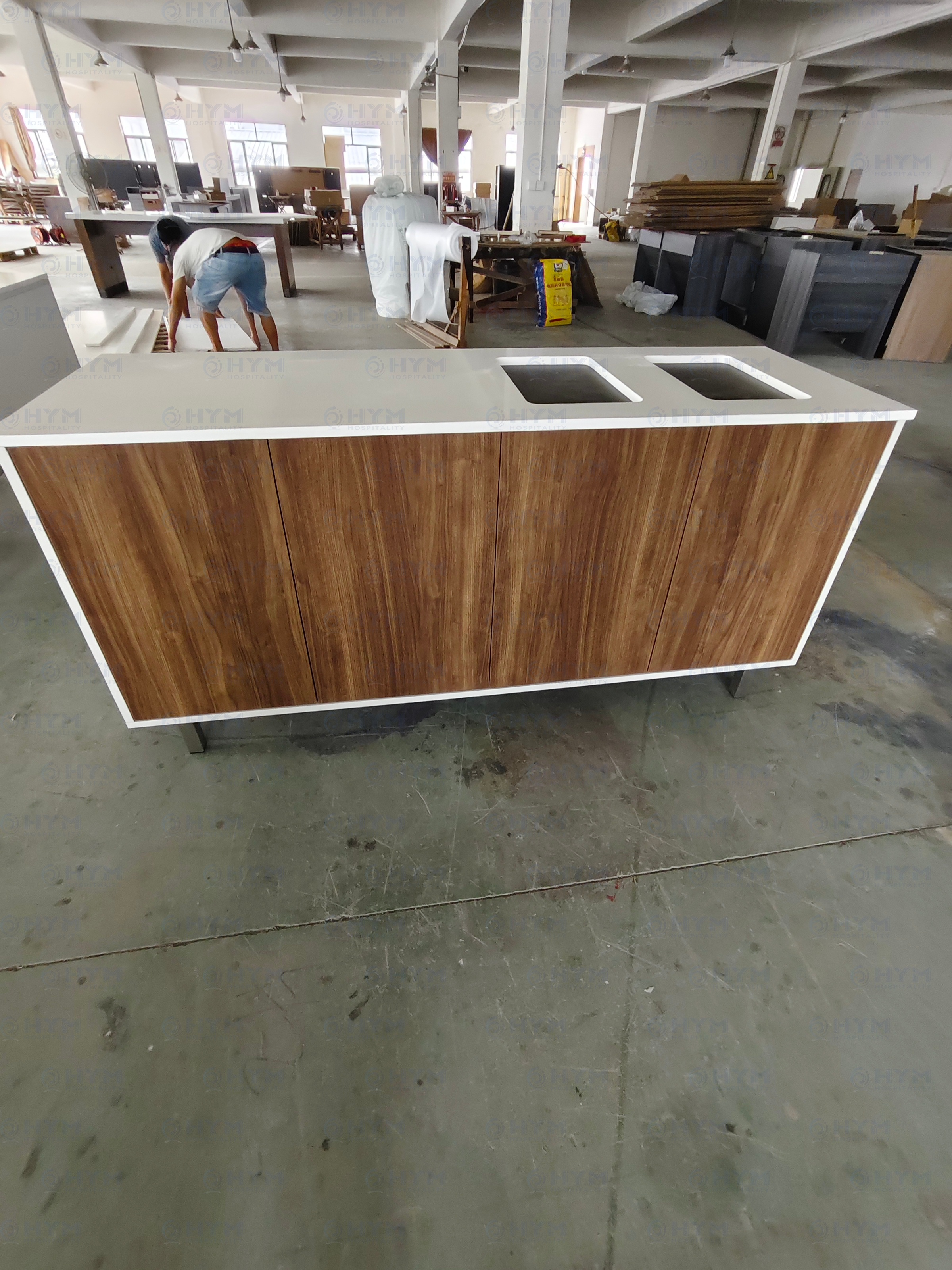 Final inspection of a 72-inch Holiday Inn Express lobby console at the factory before secure DDP shipping.