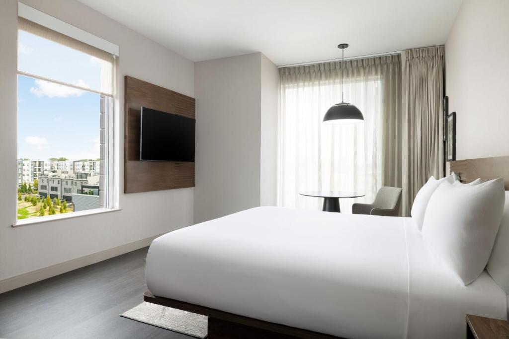 Modern minimalist hospitality FF&E package for AC Marriott projects, showcasing clean lines and site-adaptive casegoods layout.