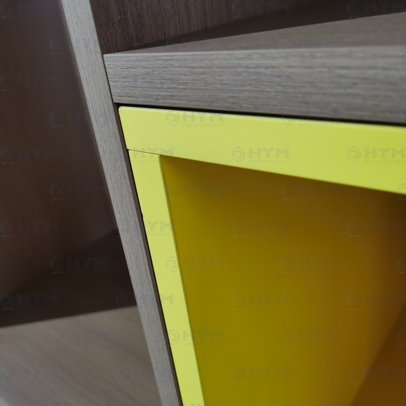 Macro view of 2mm impact-resistant PVC edgebanding and high-pressure laminate finish on a commercial-grade hotel unit.