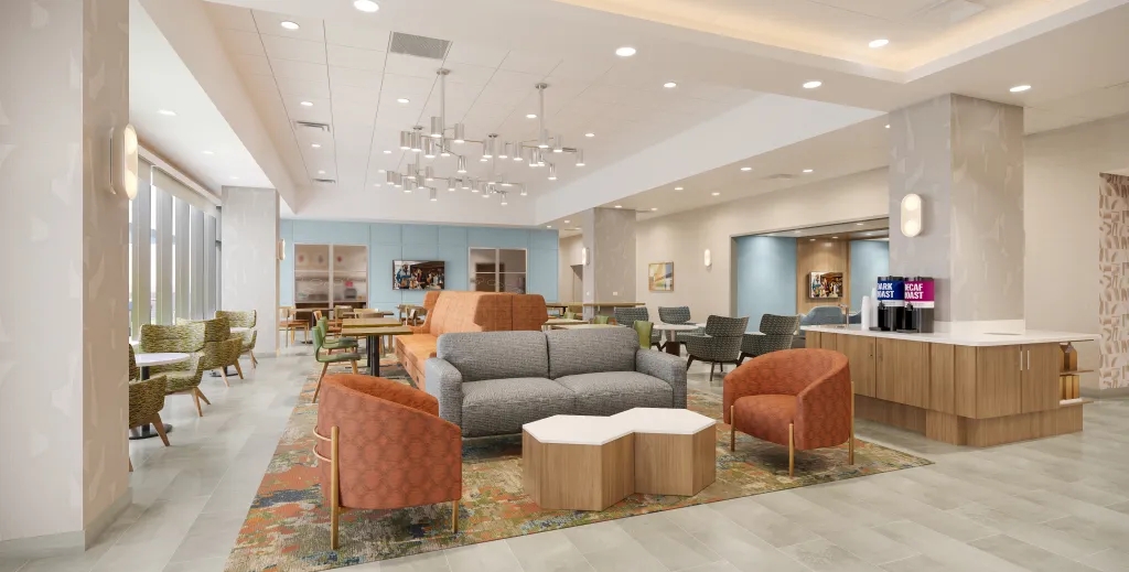 PA-107 lounge chairs arranged in a contemporary Hampton Inn hotel lobby seating area, creating an inviting hospitality space.