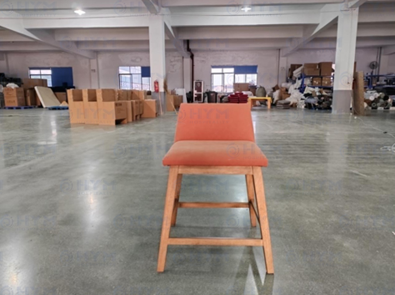 Frontal view of PA-109 stool real sample highlighting the Rusty Orange textured fabric and frame structure.