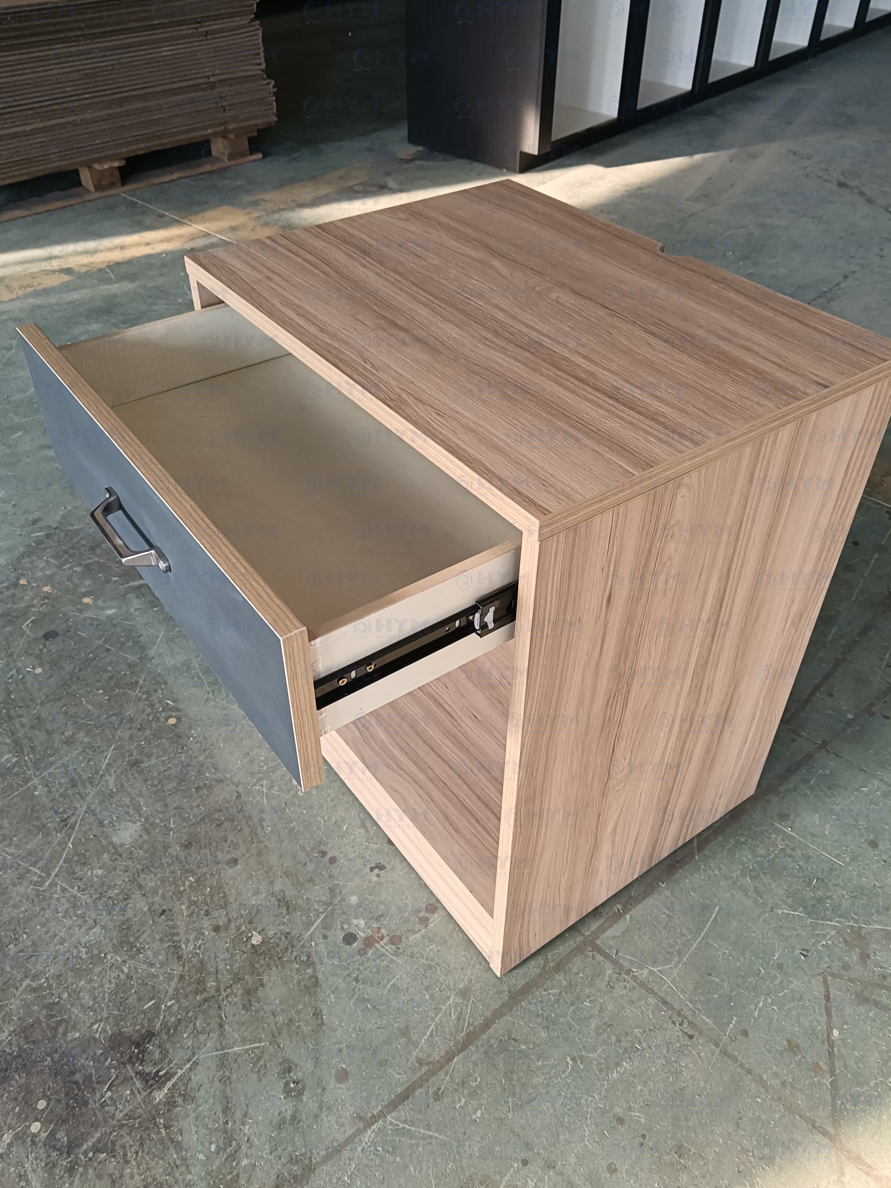 Perspective view of the CG-207 nightstand highlighting the integrated top cutout for cord management in modern hotel rooms.