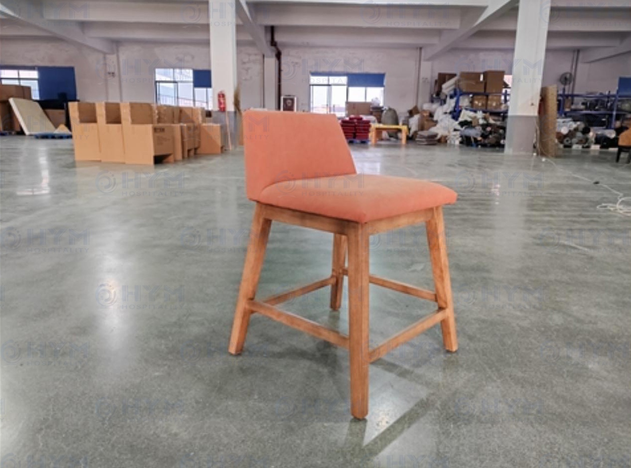 Front perspective view of PA-109 flex seating stool sample in a professional production environment.
