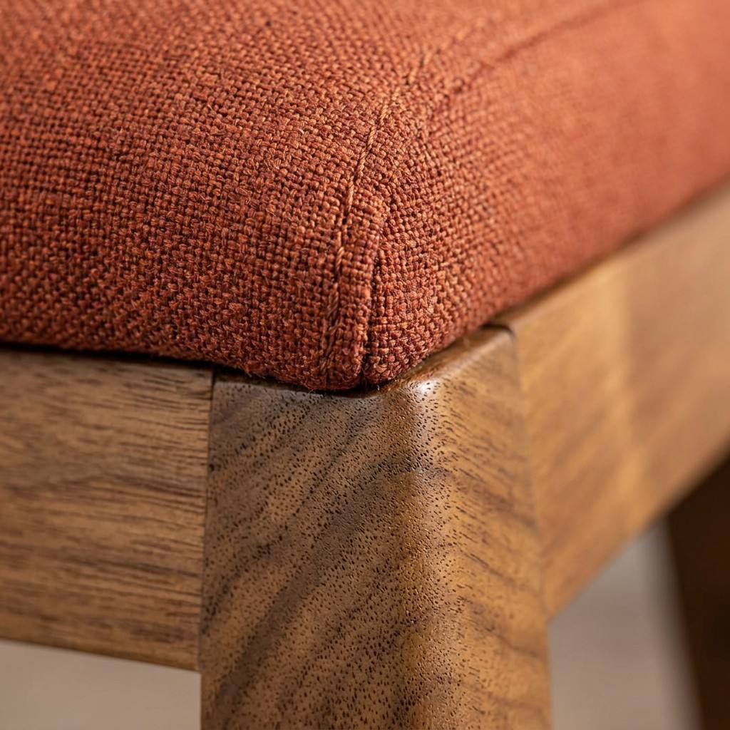 Macro shot of PA-109 stool corner showing double top-stitch upholstery and premium wood finish quality.
