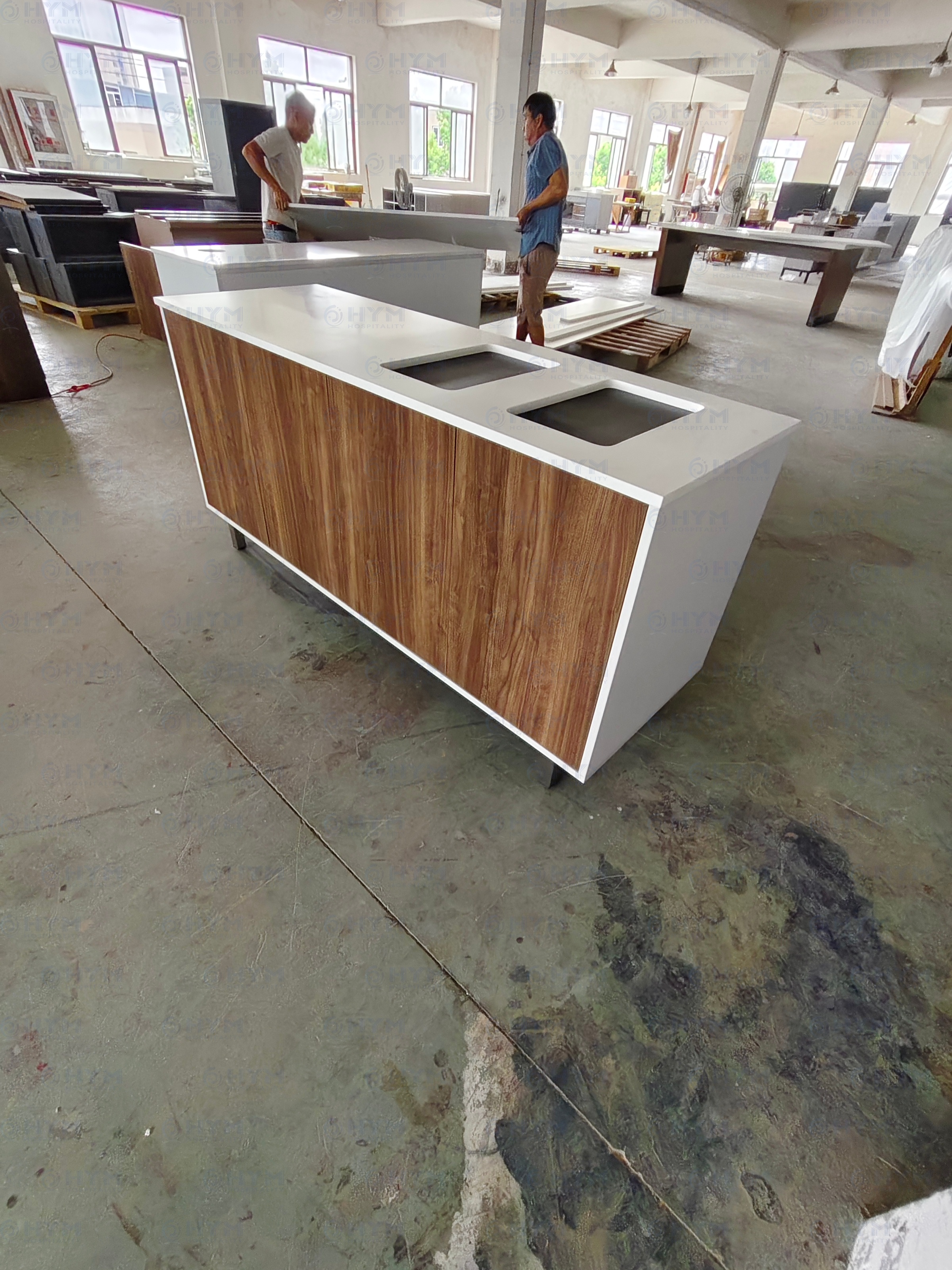 Mass production of Formula Blue 2.0 lobby furniture at Hyman factory, demonstrating large-scale capacity for North American projects.