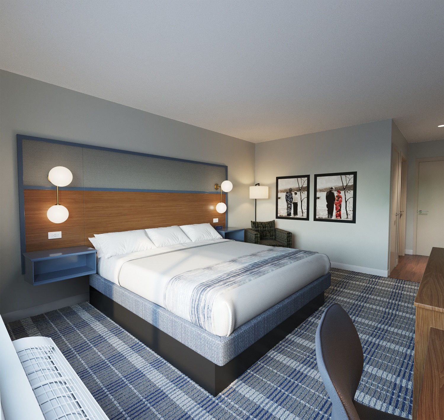 AmericInn Hotel & Suites King Guestroom interior featuring a modern bedroom furniture set with integrated headboard, blue nightstands, and wall-mounted lighting.