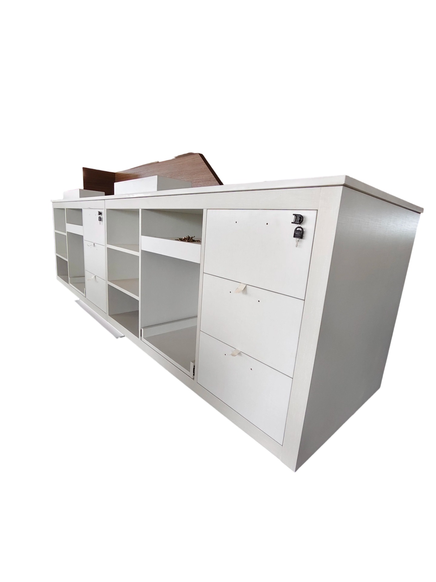 Institutional-grade reception pod for Holiday Inn Express with reinforced locking cabinetry and precision-milled shelving for guest service equipment.