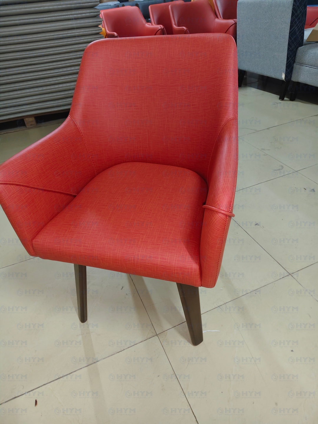 Rear side view of IHG brand compliant Formula Blue dining chair with tight upholstered contract-grade fabric.