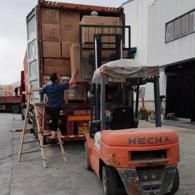 Efficient container loading and logistics management at Hyman factory, supporting seamless DDP shipping services for US and Canadian hotel developments.