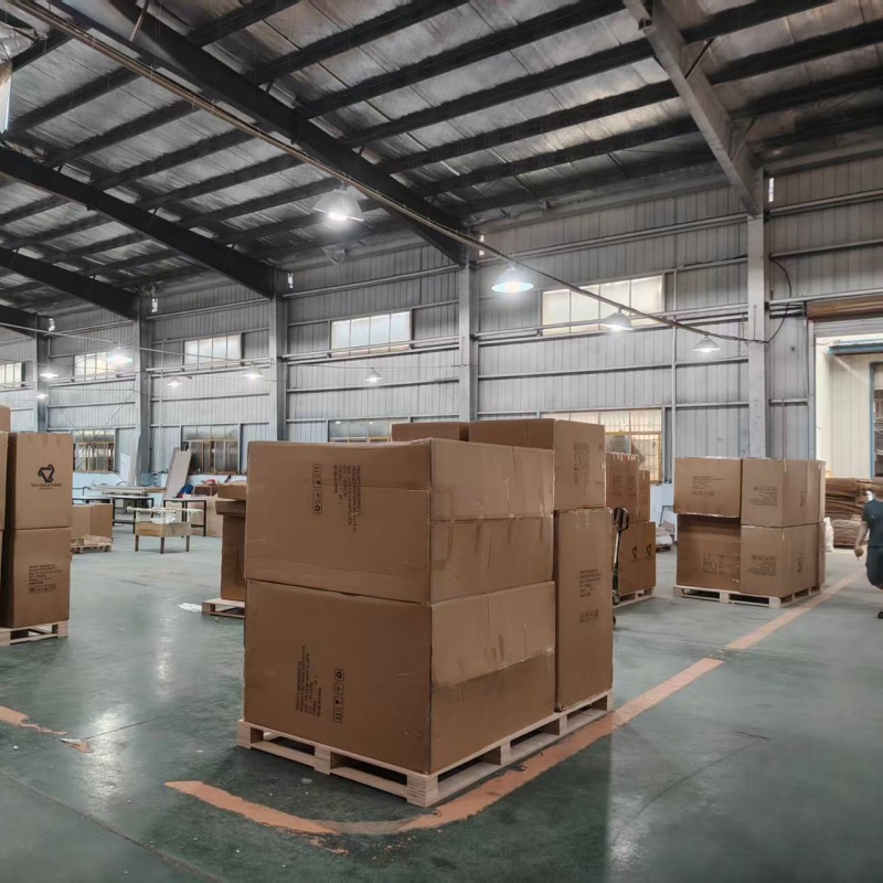 Staging area at Hyman Hospitality factory featuring reinforced export-grade cartons on pallets for bulk hotel FF&E orders destined for North America.